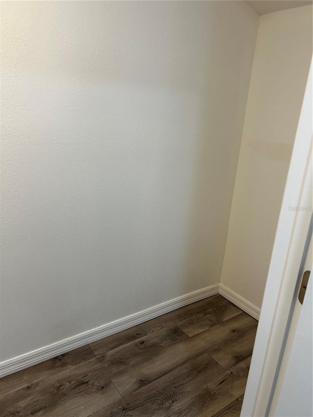 empty room featuring dark hardwood / wood-style flooring