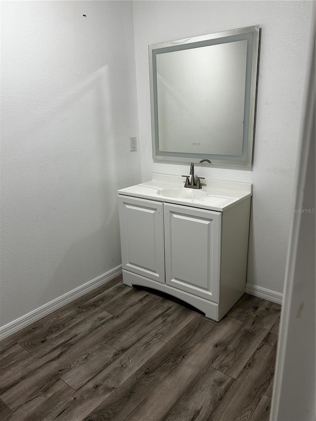 bathroom featuring vanity and wood-type flooring