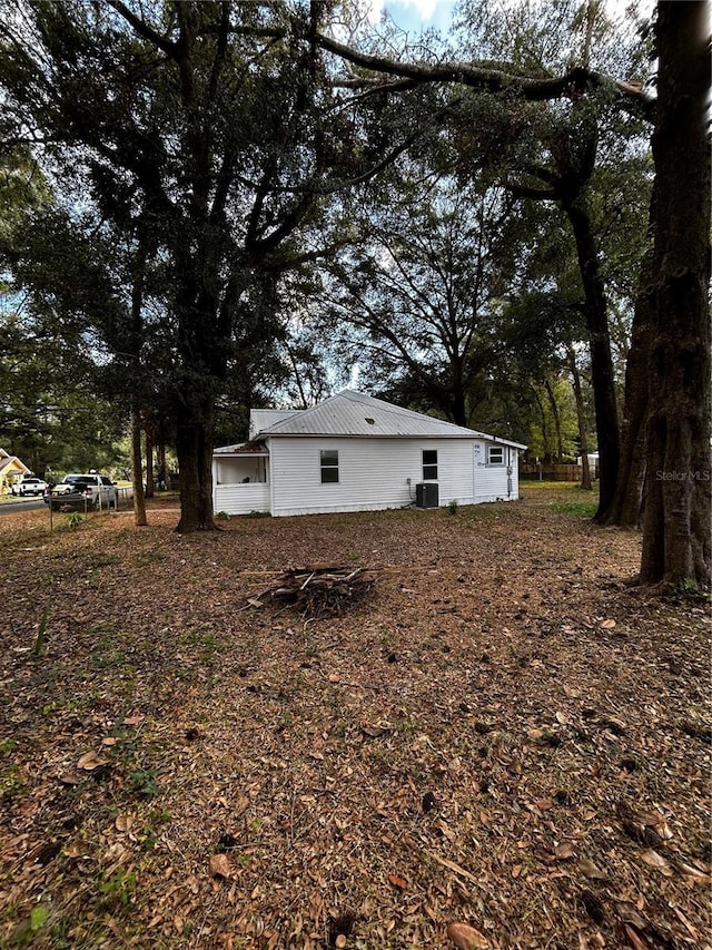 view of side of home with cooling unit