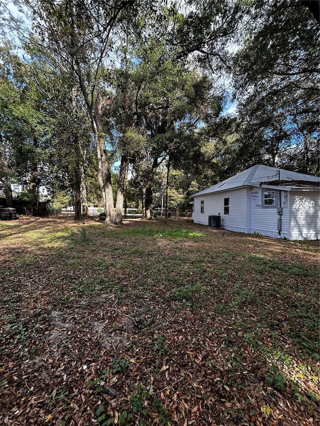 view of yard featuring central AC