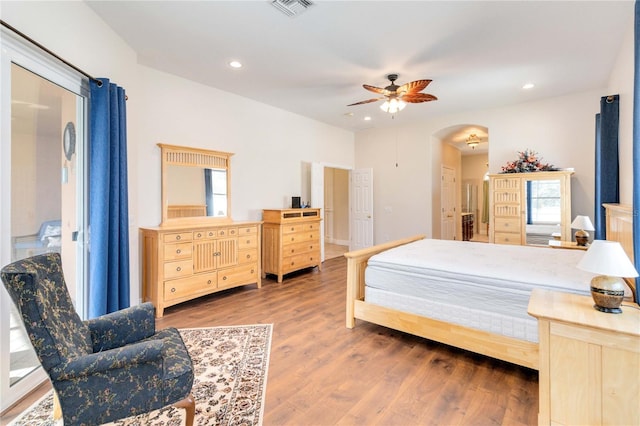 bedroom with ceiling fan and wood-type flooring