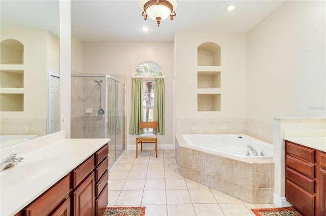 bathroom featuring tile patterned floors, vanity, built in features, and independent shower and bath