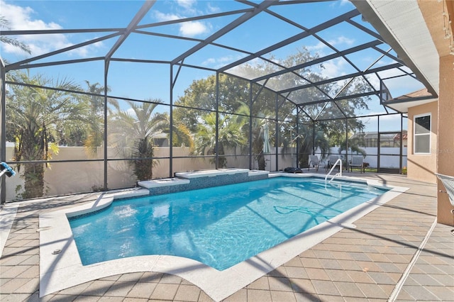 view of swimming pool with a lanai and a patio