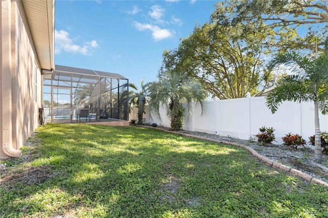 view of yard with a lanai