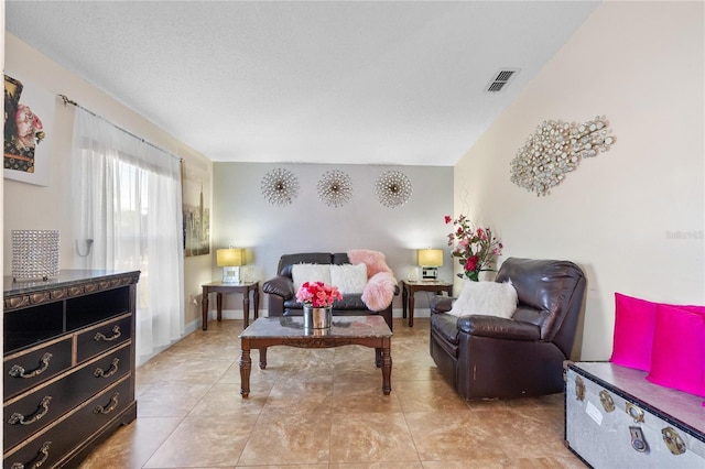 living room with tile patterned flooring