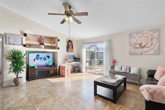 tiled living room with a textured ceiling, ceiling fan, and lofted ceiling