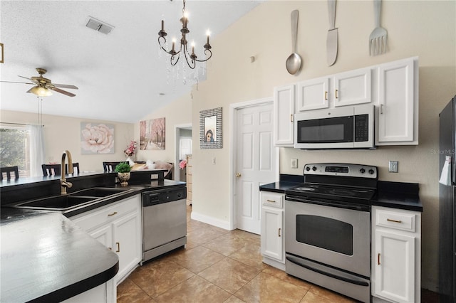 kitchen with white cabinets, ceiling fan with notable chandelier, stainless steel appliances, and sink