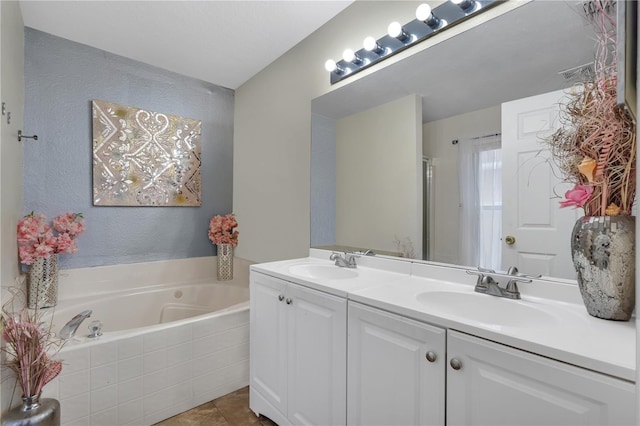 bathroom featuring tile patterned floors, plus walk in shower, and vanity