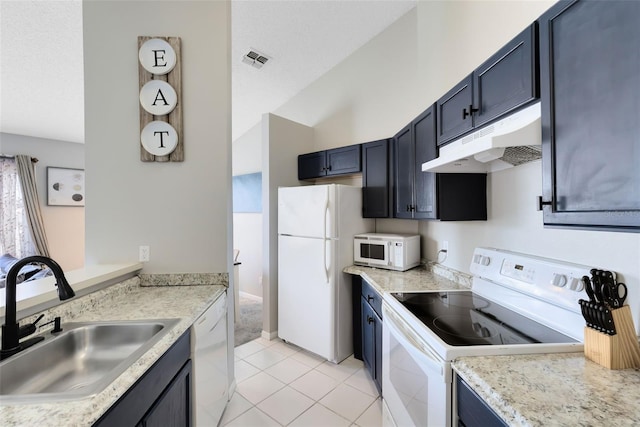 kitchen featuring blue cabinets, white appliances, sink, and light tile patterned floors