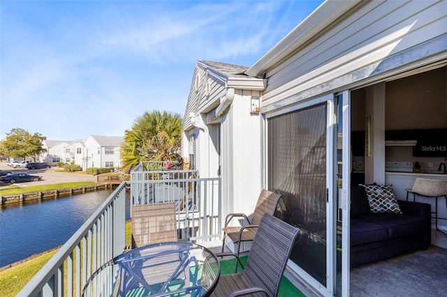 balcony featuring a water view