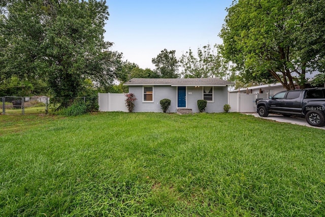 ranch-style house with a front lawn