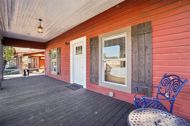 wooden terrace featuring a porch