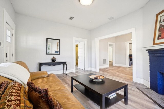 living room with light hardwood / wood-style flooring