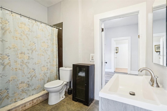 bathroom featuring tile patterned floors, vanity, toilet, and a shower with shower curtain