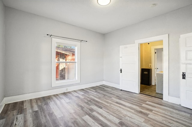 empty room with light wood-type flooring