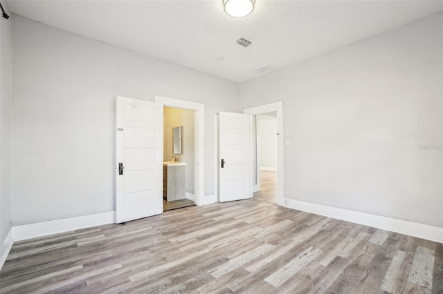 empty room featuring light wood-type flooring