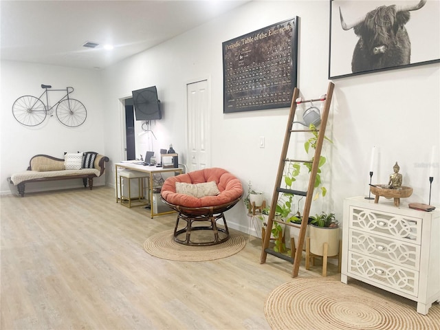 sitting room with light wood-type flooring