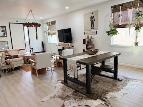 dining area with wood-type flooring