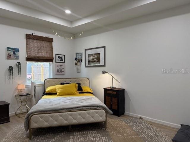 bedroom with wood-type flooring