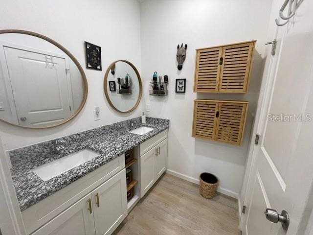 bathroom featuring hardwood / wood-style floors and vanity