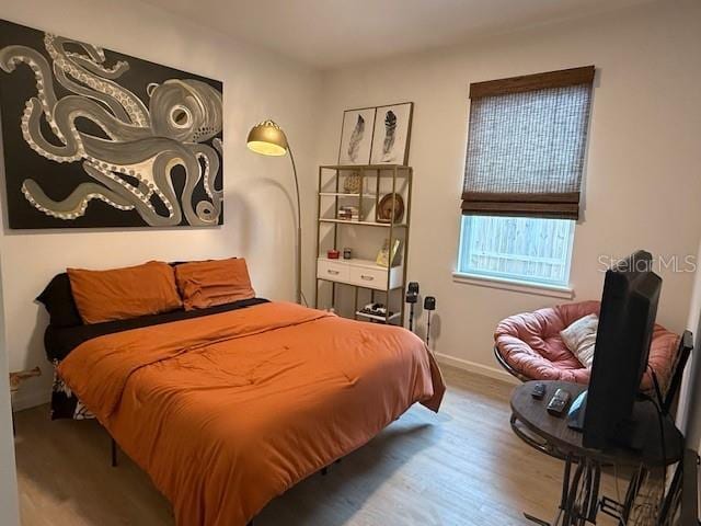 bedroom featuring wood-type flooring