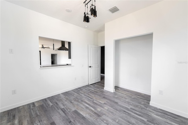 unfurnished bedroom with hardwood / wood-style floors