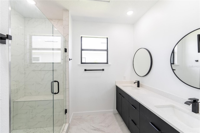 bathroom featuring vanity and a shower with shower door