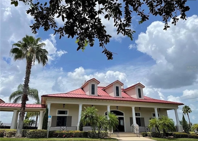view of front of property with central AC and a porch