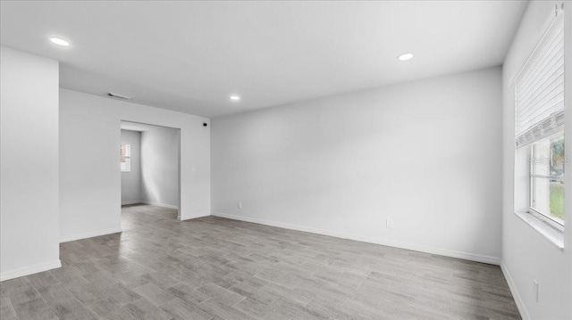 empty room with light hardwood / wood-style floors