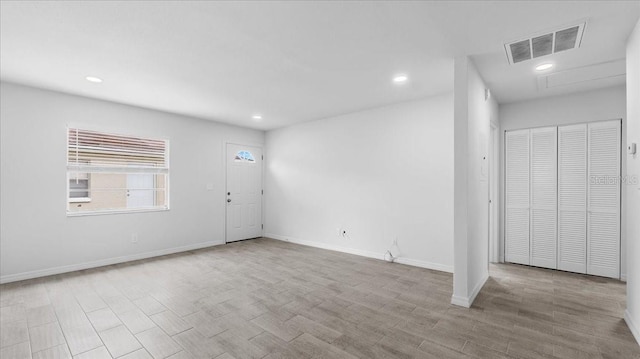 unfurnished room featuring light hardwood / wood-style floors