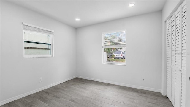 spare room featuring light hardwood / wood-style floors