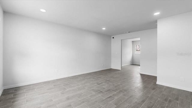 unfurnished room with light hardwood / wood-style floors