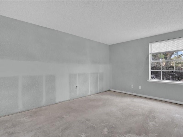 spare room featuring a textured ceiling