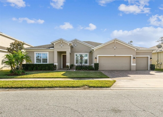 ranch-style home with a front yard and a garage