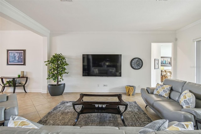 living room featuring tile patterned floors and ornamental molding