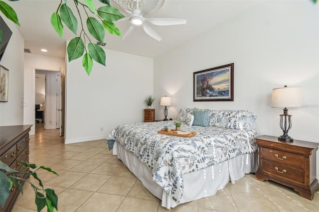 tiled bedroom featuring ceiling fan