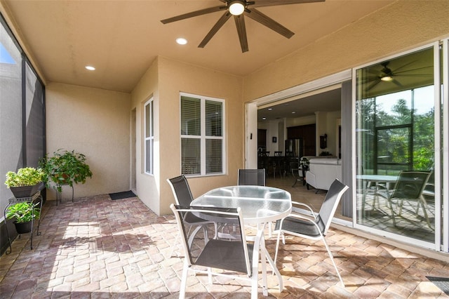 view of patio featuring ceiling fan