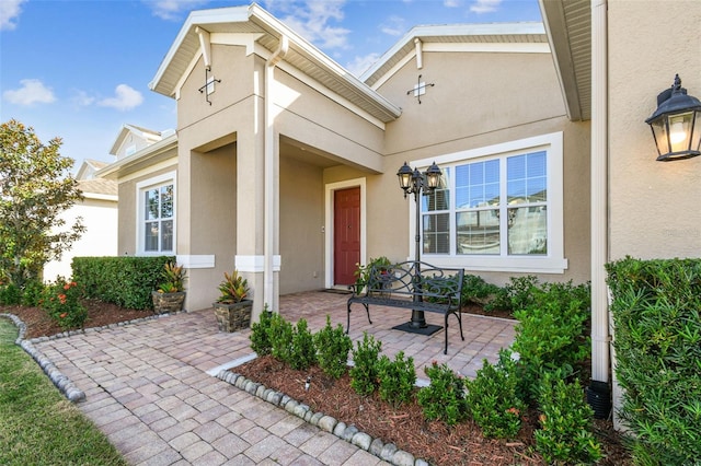 entrance to property featuring a patio