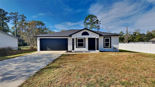 ranch-style home with a front lawn and a garage