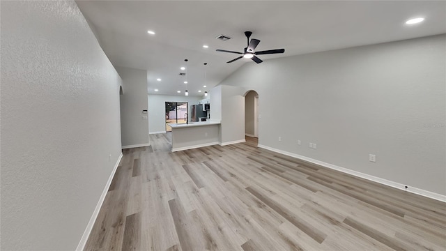 unfurnished living room with ceiling fan and light hardwood / wood-style flooring