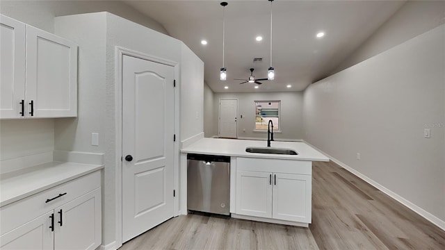 kitchen with pendant lighting, sink, vaulted ceiling, stainless steel dishwasher, and ceiling fan