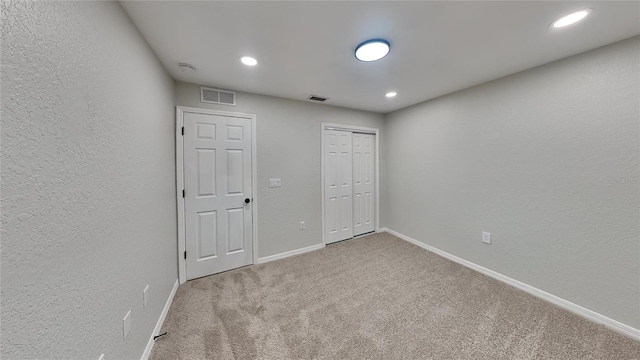 unfurnished bedroom with carpet flooring