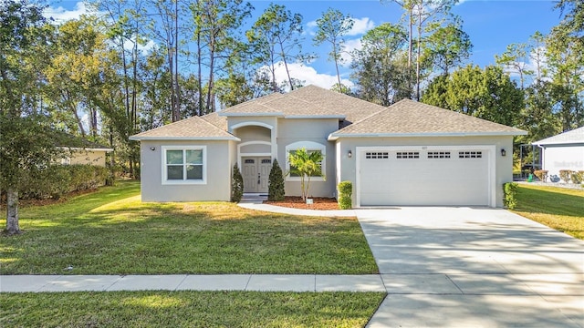 view of front of home featuring an attached garage, a shingled roof, driveway, stucco siding, and a front yard