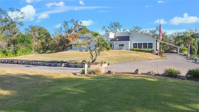 view of property's community with a yard