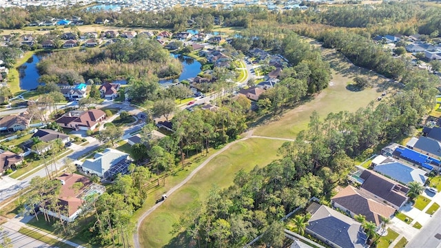 drone / aerial view featuring a water view and a residential view