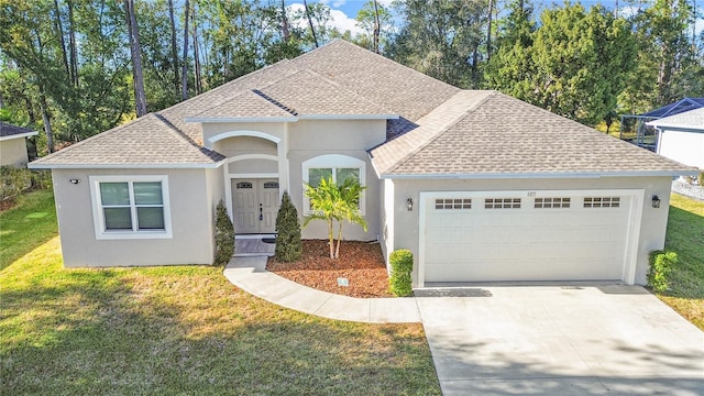 view of front facade featuring a front lawn and a garage