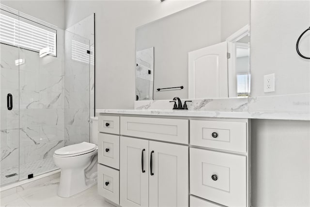 full bathroom with toilet, marble finish floor, a marble finish shower, and vanity