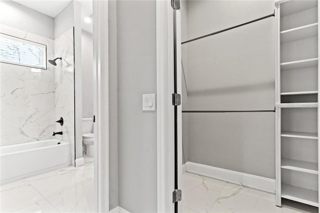 full bath with  shower combination, marble finish floor, toilet, and baseboards