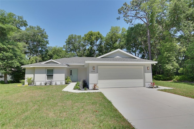 ranch-style house with a garage and a front lawn