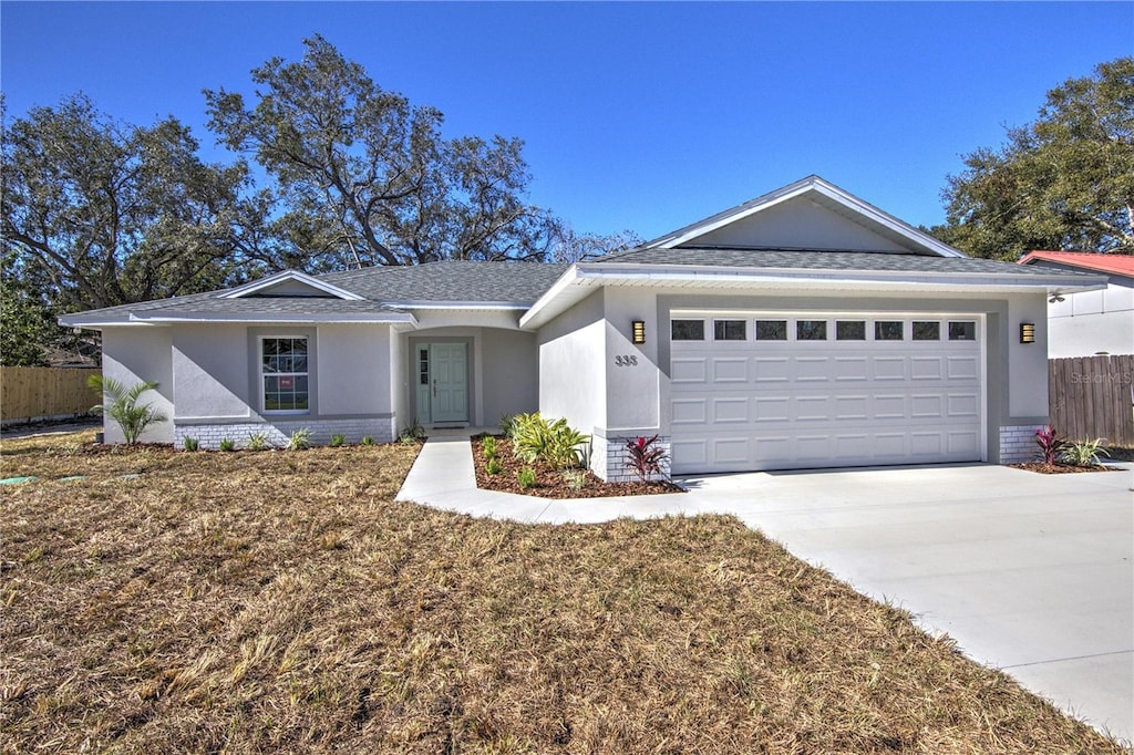 ranch-style house featuring a garage